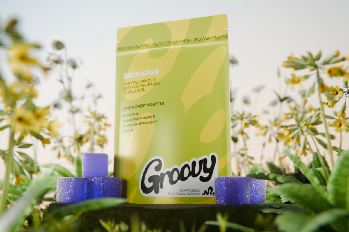 Groovy Lemon Drop Martini recovery gummies with purple gummies surrounded by flowers