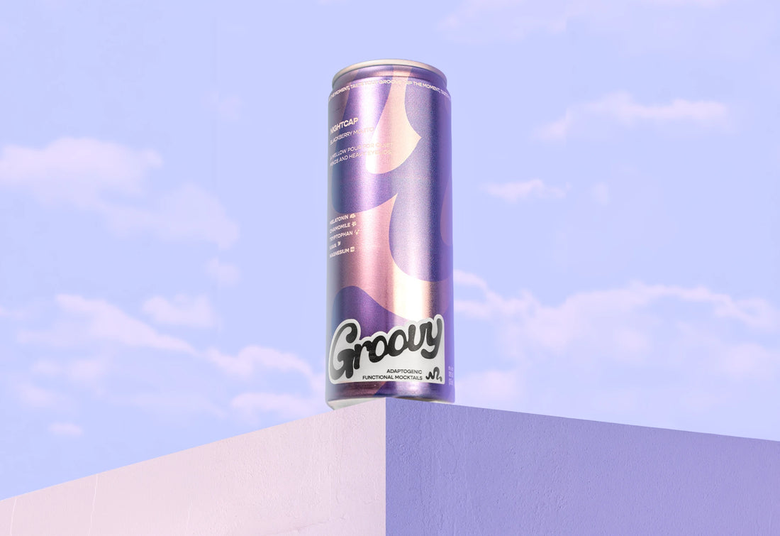 Purple Groovy Nightcap can balanced on a ledge against a lilac sky