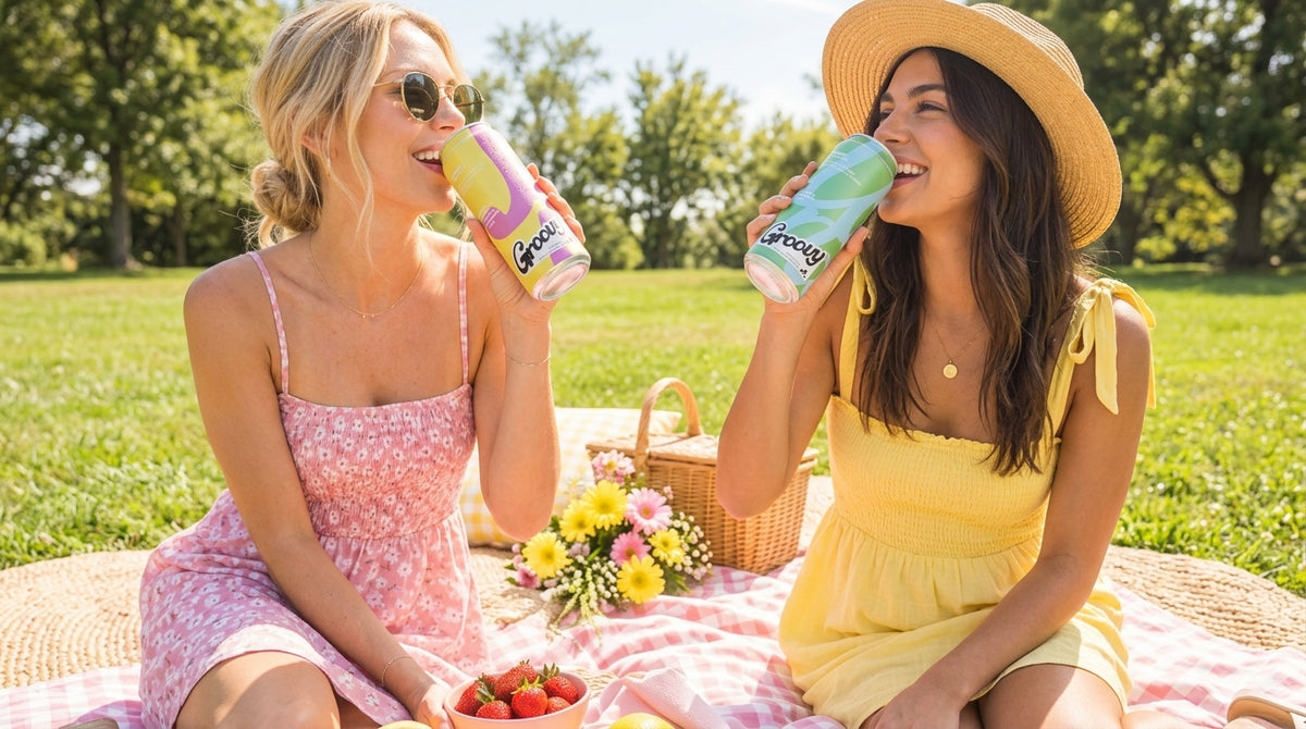 Two friends enjoying Groovy drinks at a picnic