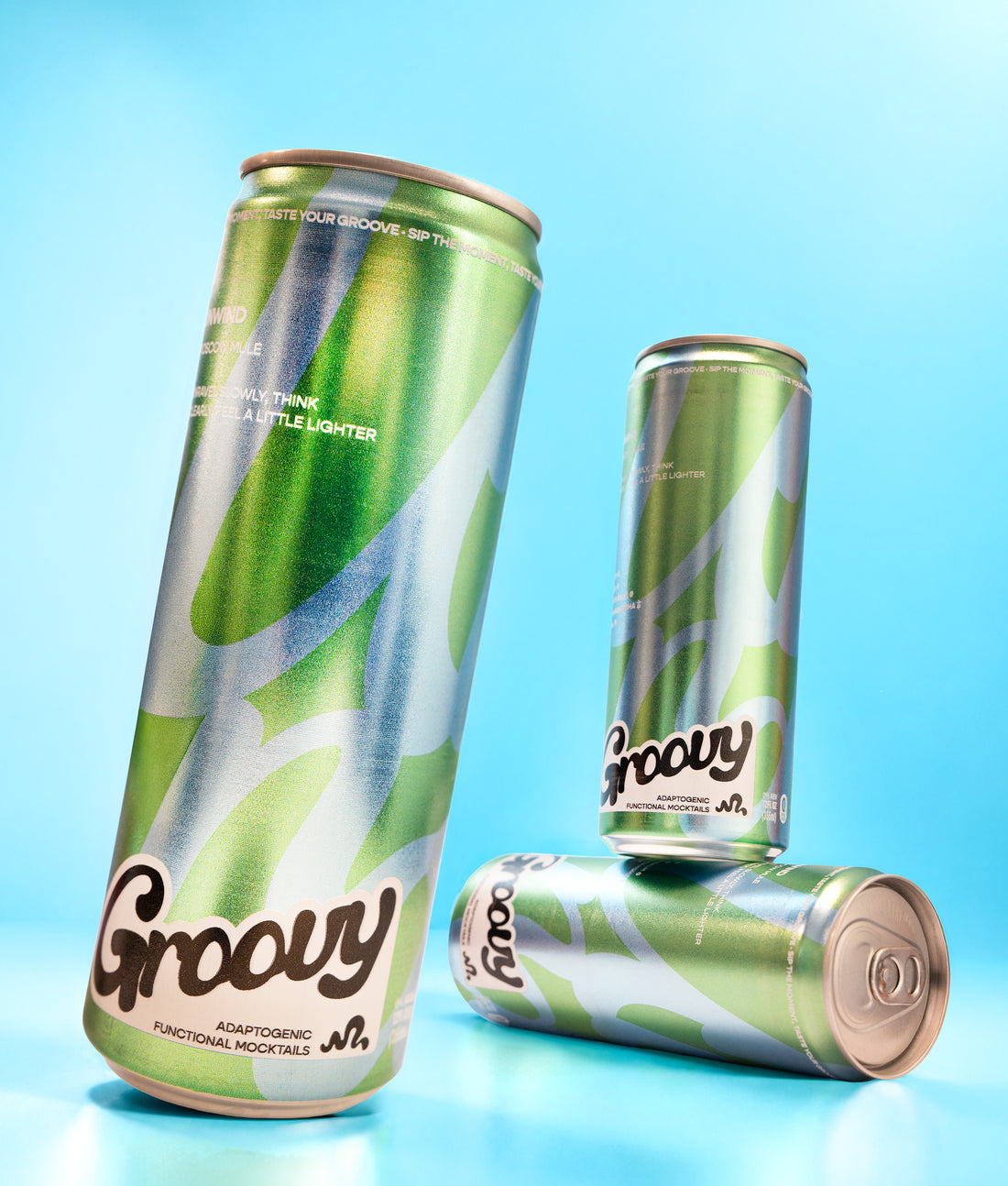 Green Groovy Unwind cans arranged against a bright blue backdrop